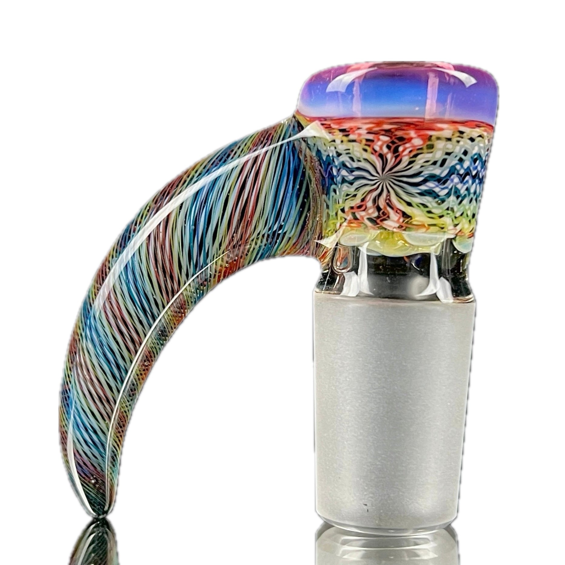 A glass slide with a multicolored, swirling design at the top and a solid, transparent lower part.