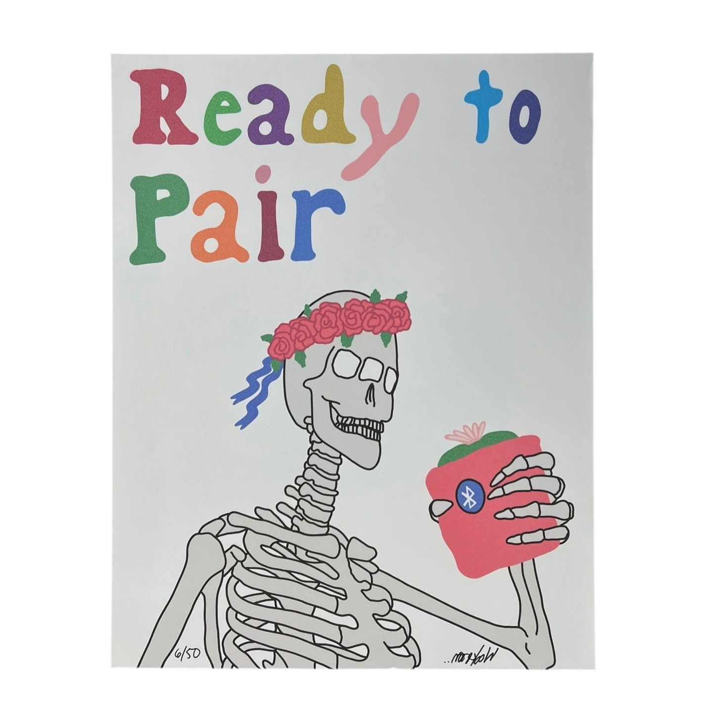 A colorful print of a skeleton with a floral crown and heart, holding a mug, with the text 'Ready to Pair' above.