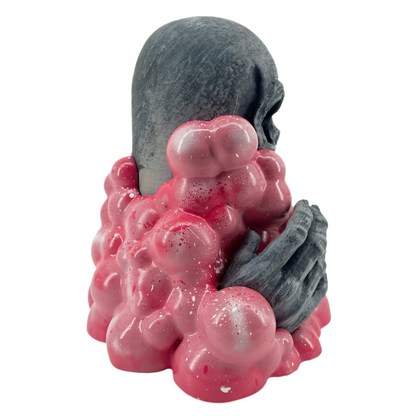 Gray and pink textured sculpture on a white background.