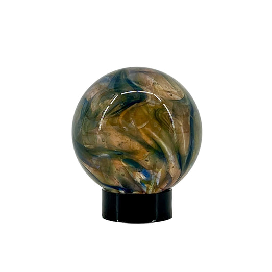 Marbled glass sphere on a black stand against a white background