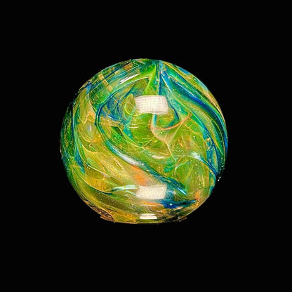 Colorful glass marble on a black background