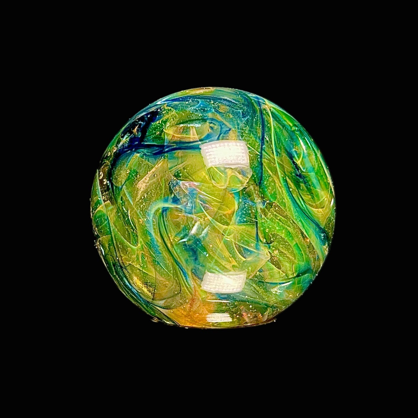 Colorful glass marble on a black background