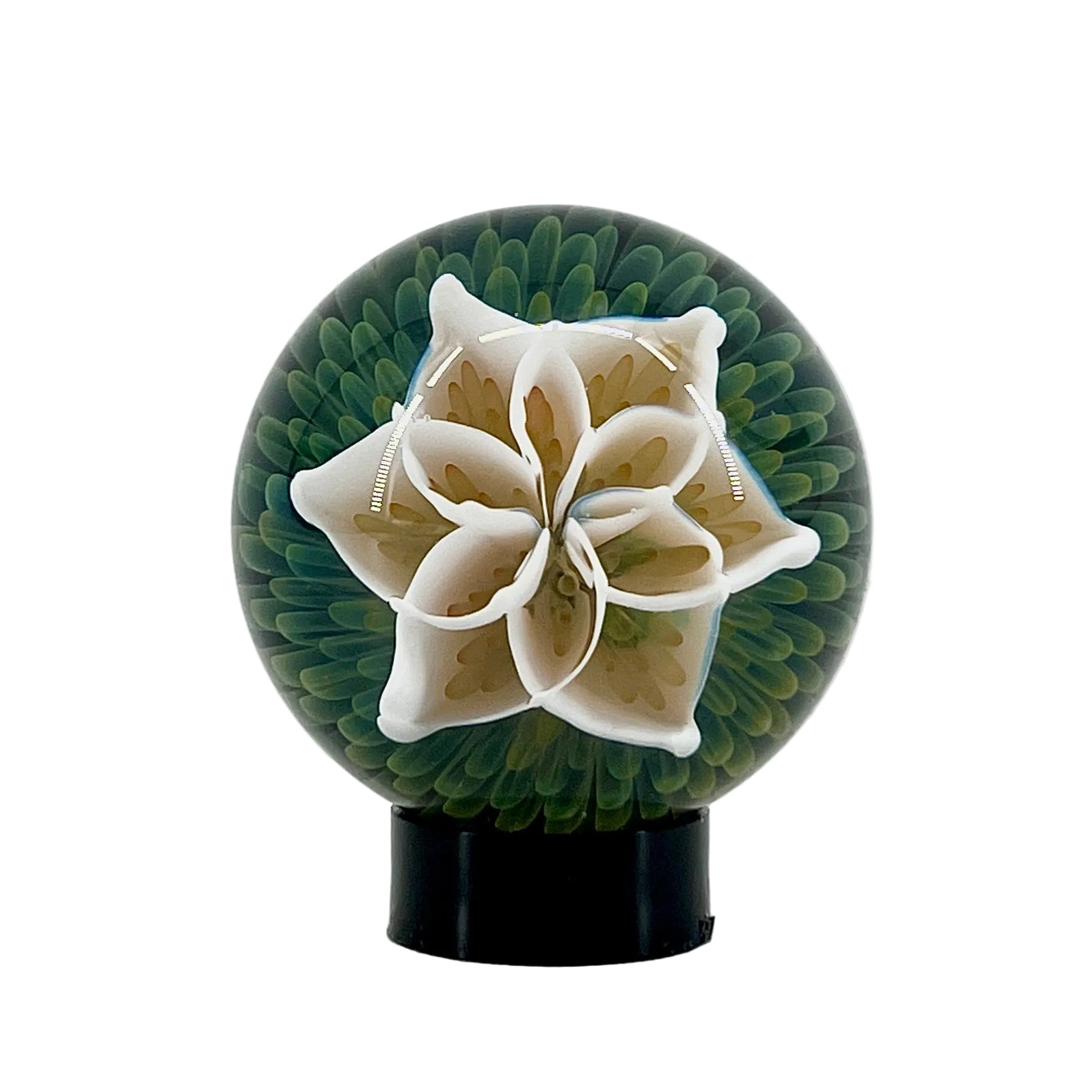 Decorative sphere with a white flower design on a white background