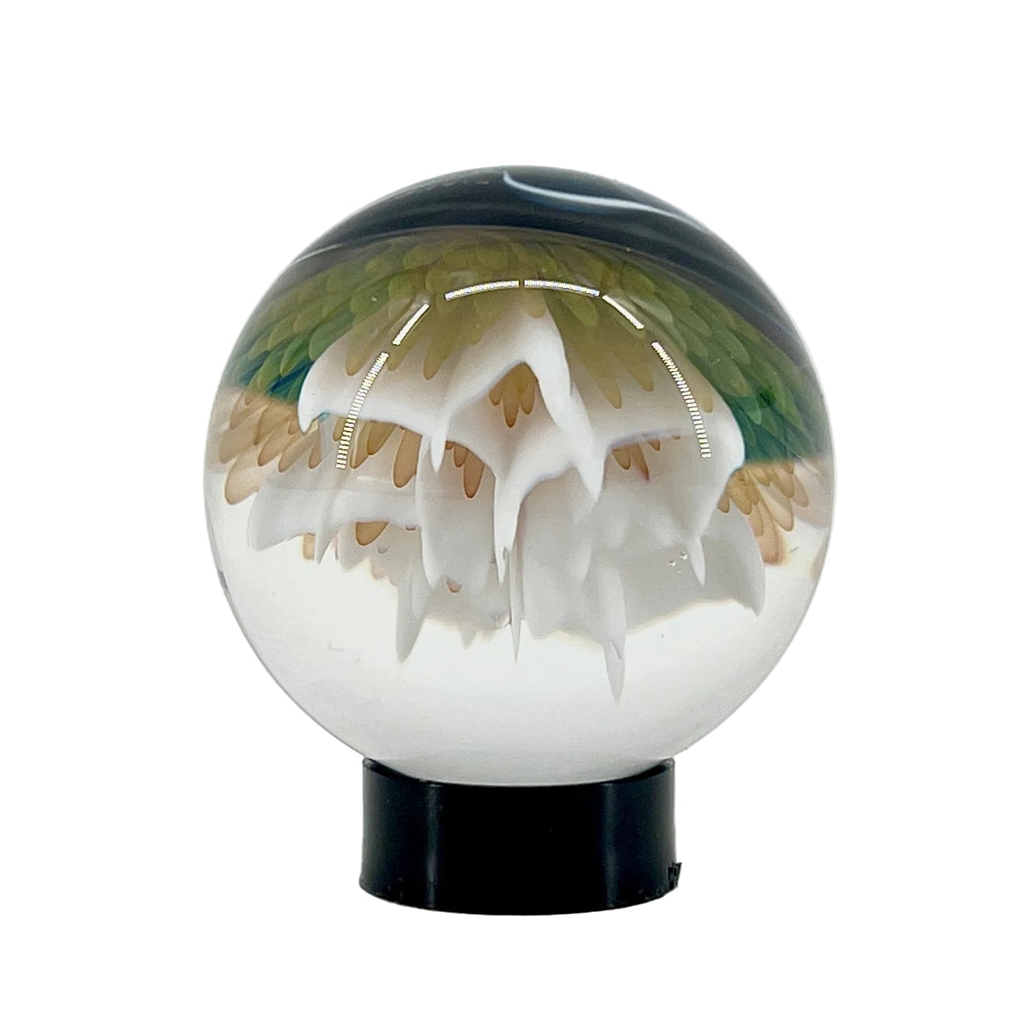 Glass sphere with a jellyfish inside on a white background