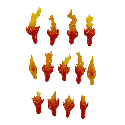 Set of 13 small red and yellow flame-shaped glass objects on a white background.