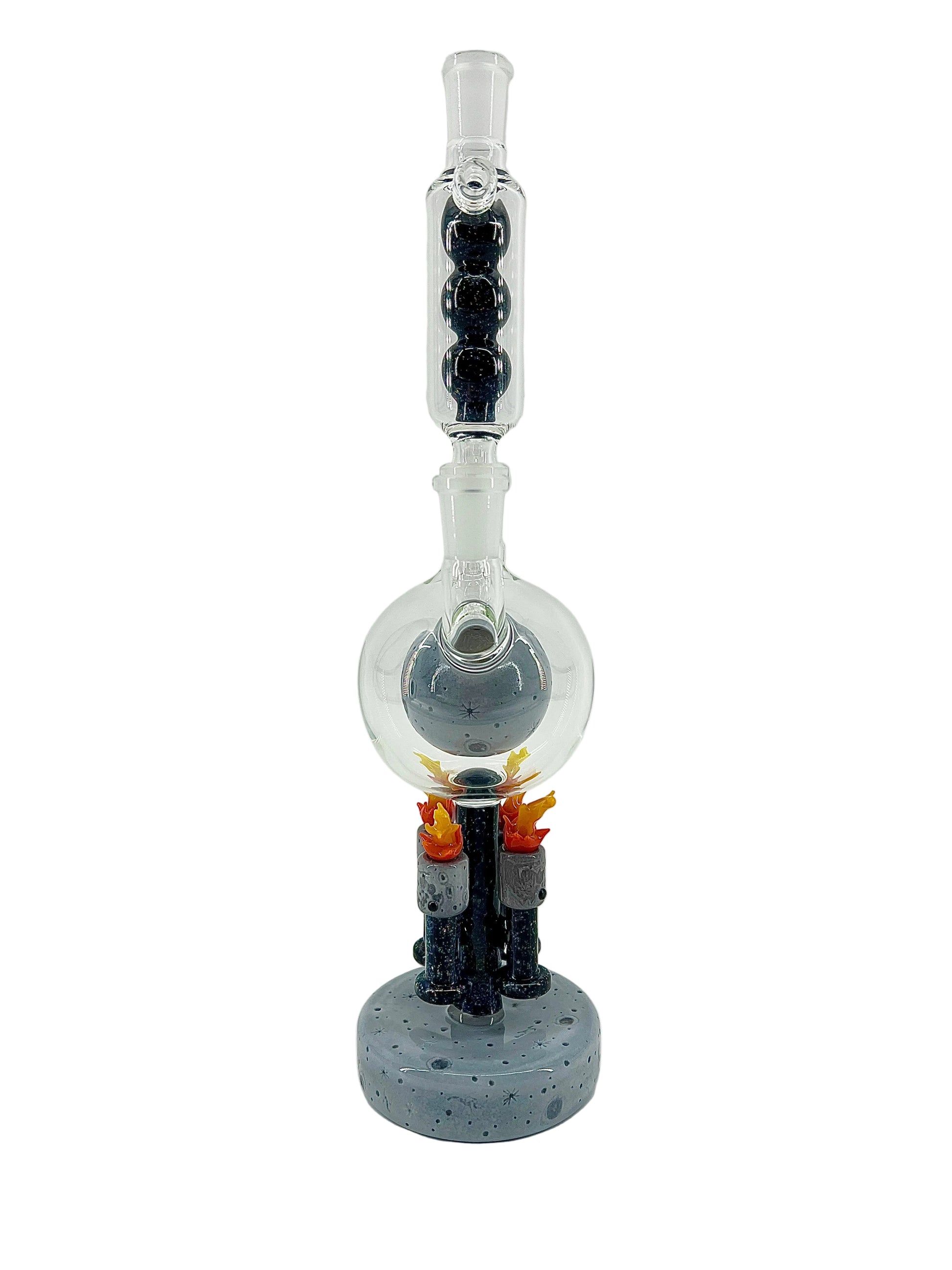Glass smoking device with a sculpted moon base on a white background.
