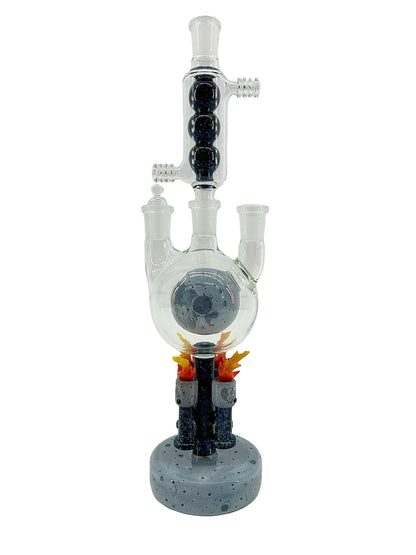 Glass smoking device with sculpted moon base on a white background