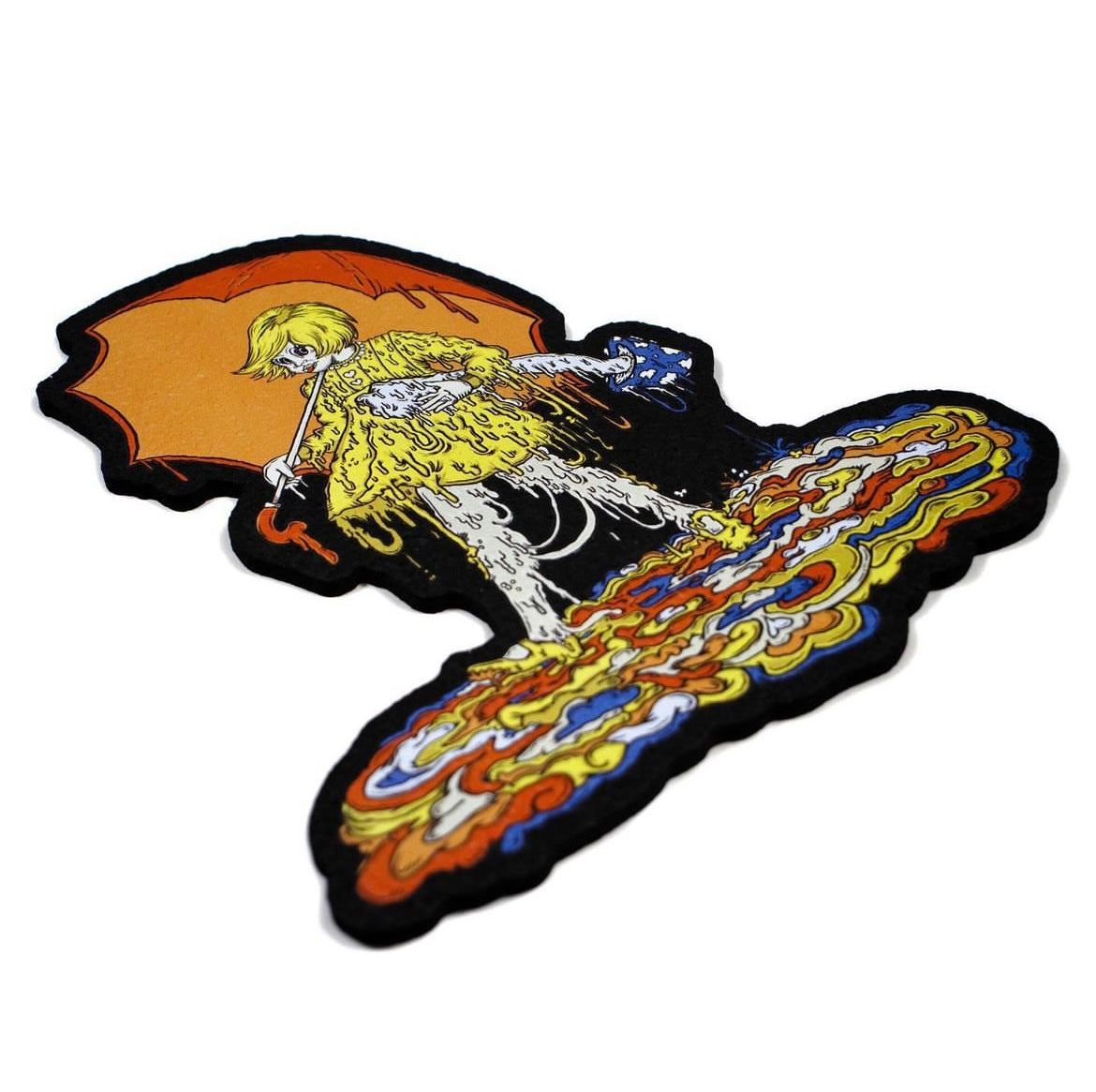 A colorful mat featuring an illustrated character with a yellow and orange palette, resembling a shroom with a female figure.