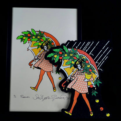 A collectible art piece featuring a character with citrus fruit accessories, released by Slinger Apparel in collaboration with Sam Lyons. The image shows the character on both a print and a moodmat, with a frame included.