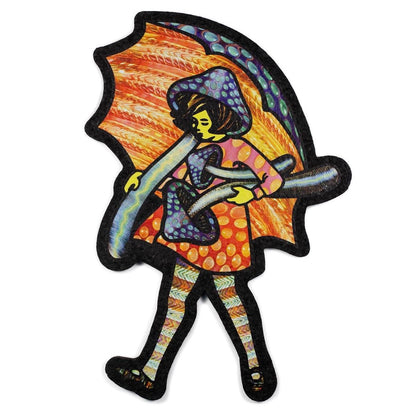 A colorful mat featuring an illustrated character with a whimsical design, predominantly orange and black, reminiscent of a mushroom.