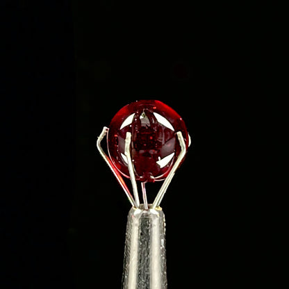 A set of three Phase Glass pieces with a swirling multicolor design, including a cap plug, valve marble, and pillar.