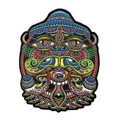 A colorful and patterned mat with a design that includes a snake and human eyes, with a predominantly black outline.