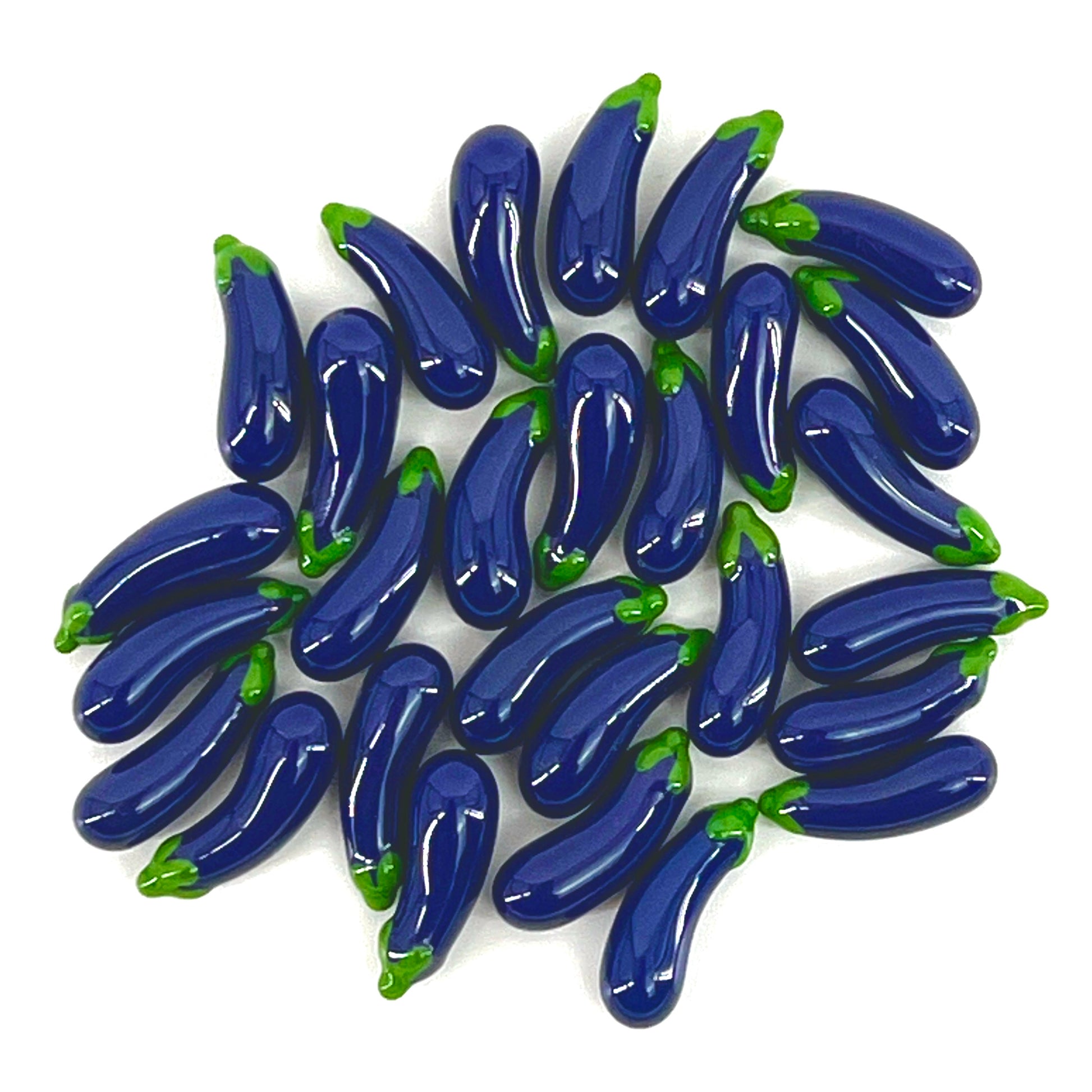 A collection of purple glass eggplant-shaped pillars with green accents.