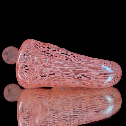 A red glass pipe with a intricate pattern, featuring a bowl and a curved stem.