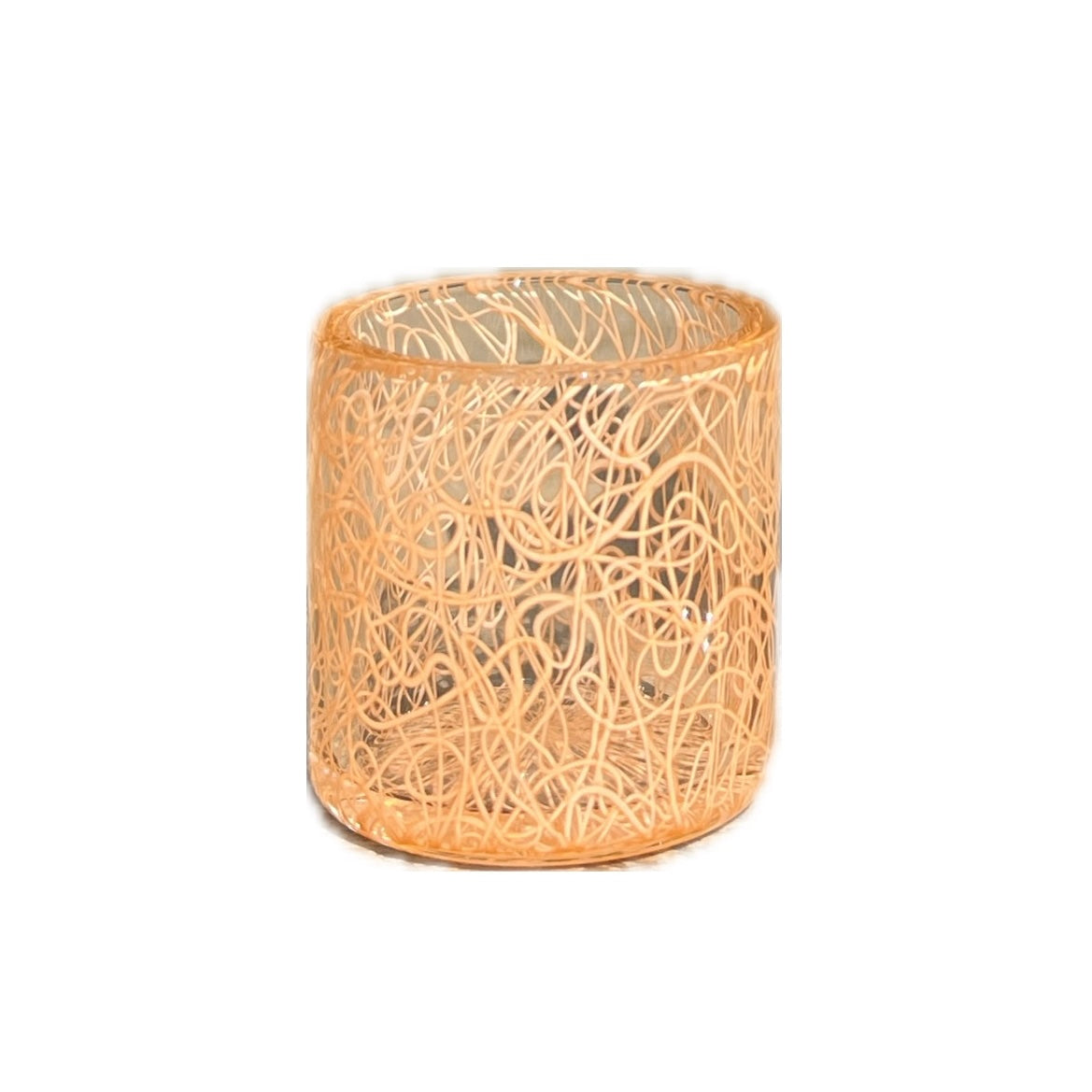 A cylindrical glass jar with an orange and beige geometric pattern, resembling a scribble or lava flow design.