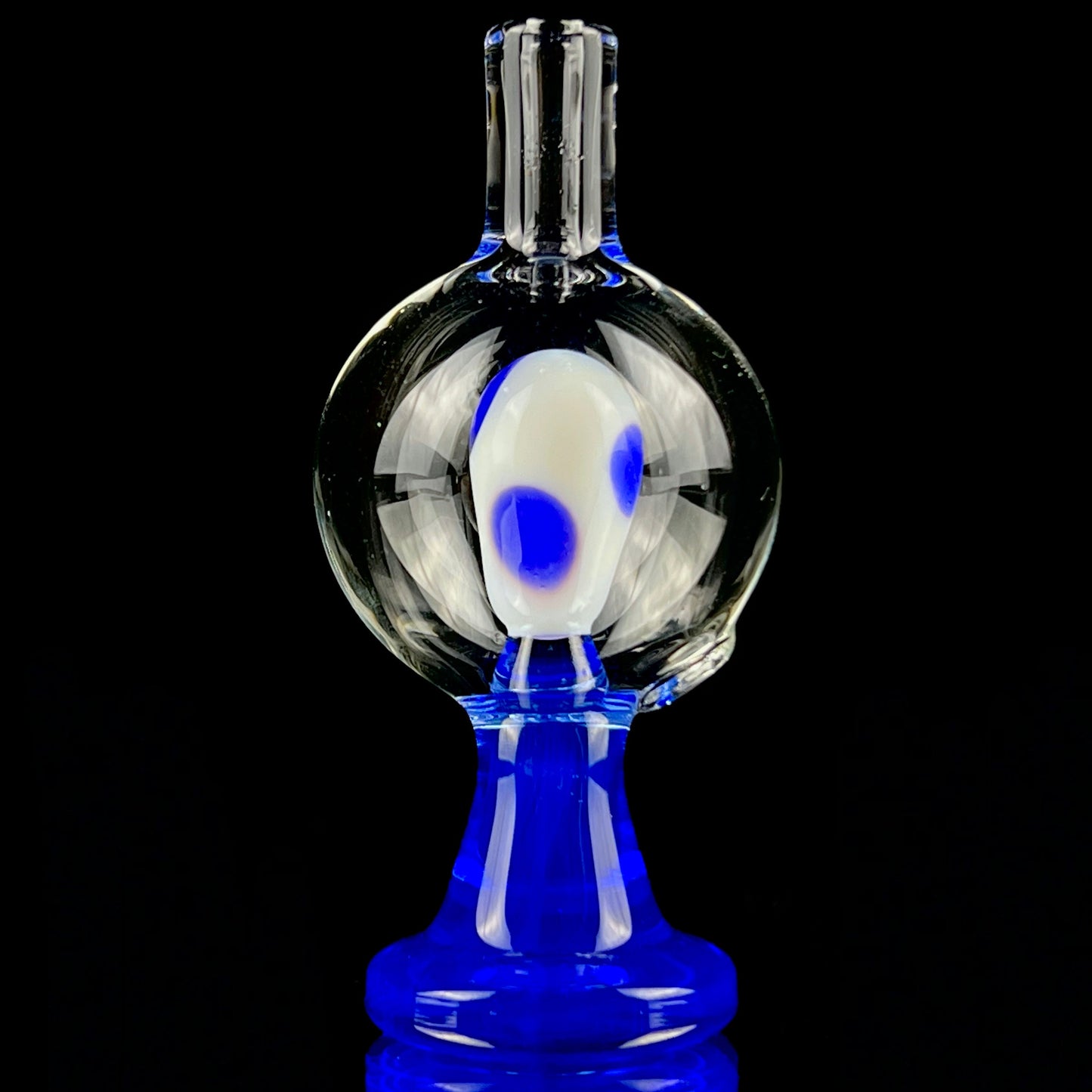 A blue and clear glass piece with a bubble cap.