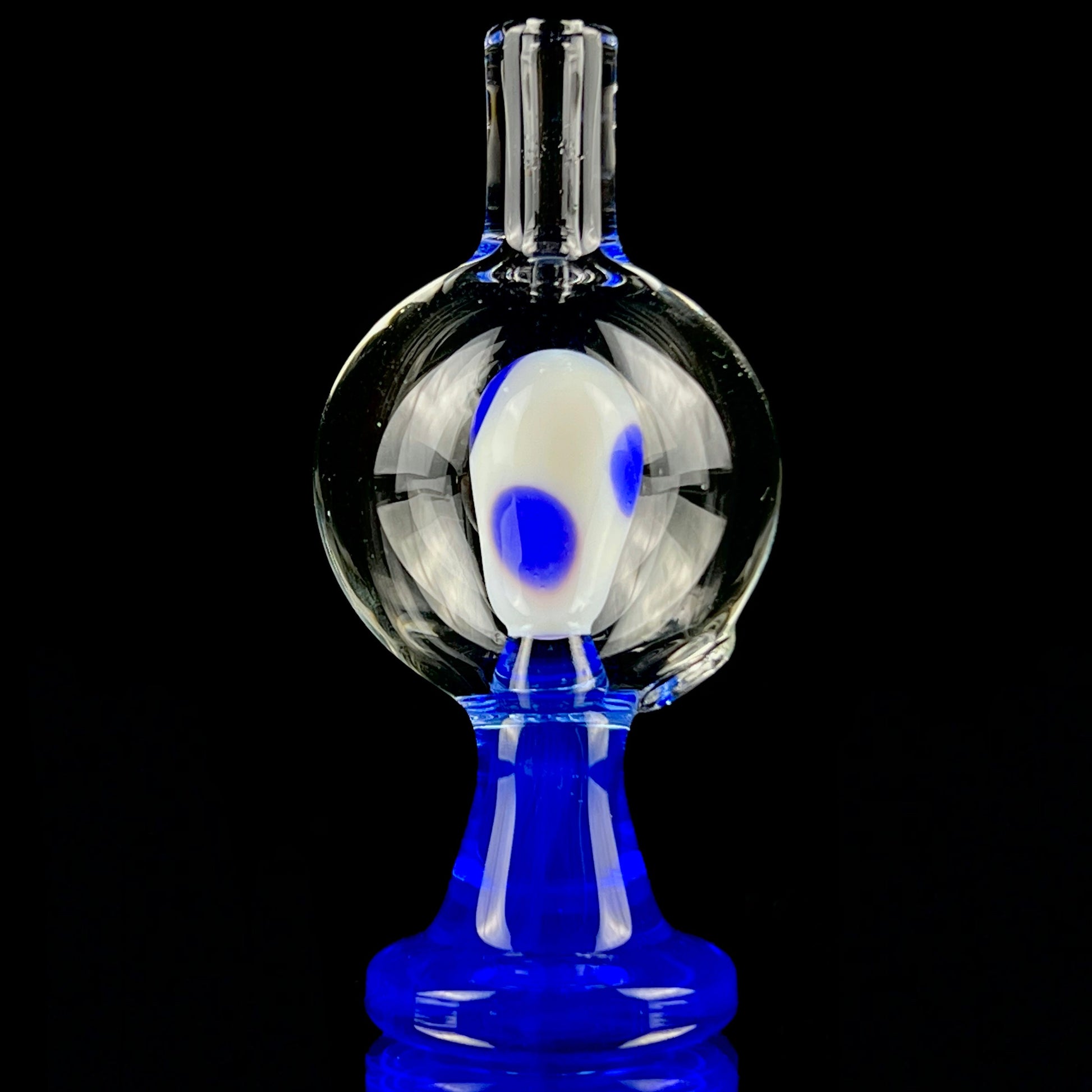 A blue and clear glass piece with a bubble cap.