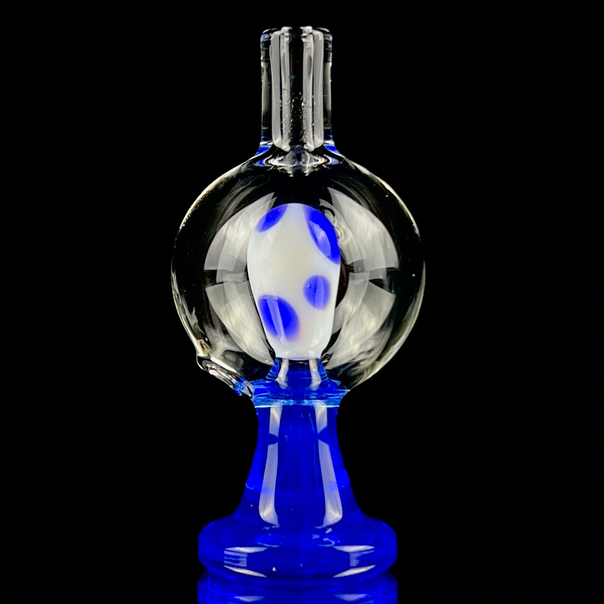 A blue and clear glass piece with a bubble cap.