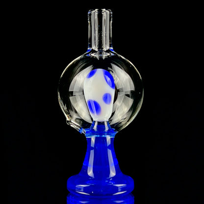 A blue and clear glass piece with a bubble cap.