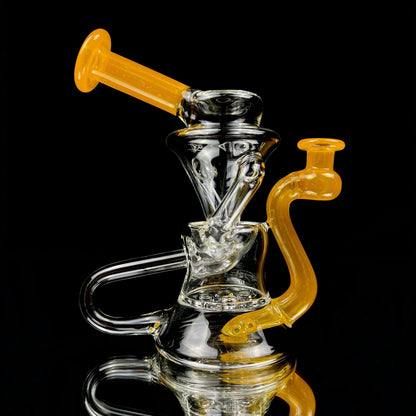 A clear glass 'Stepping Stone' style vase with yellow accents on the neck and base, featuring a 4-hole perc.