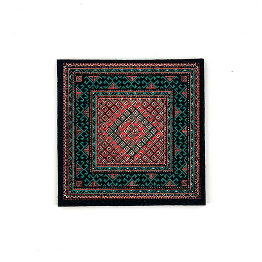 Patterned mat with geometric design on a white background