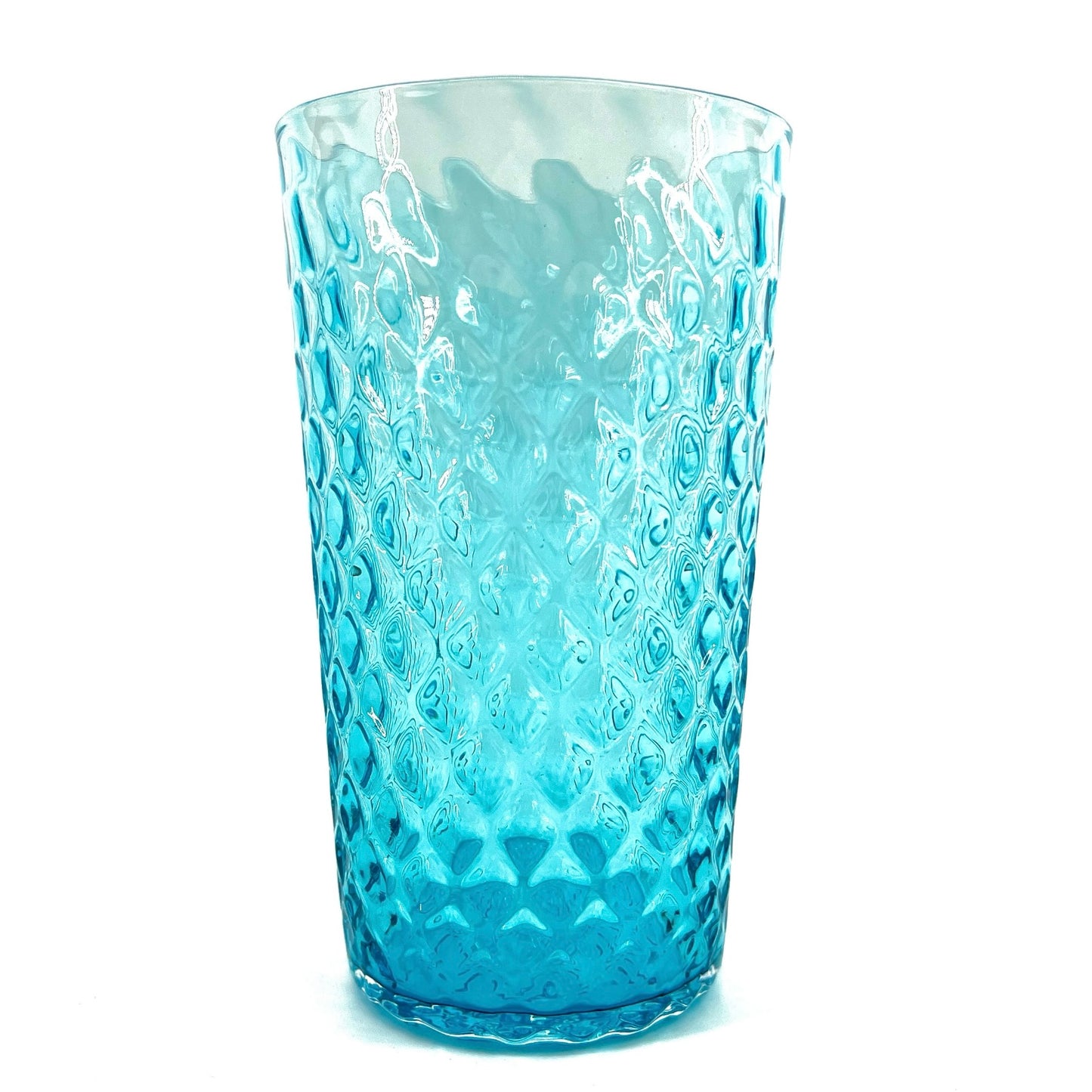 A blue glass with a geometric optic pattern