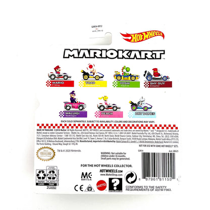 A die-cast toy car replica of Waluigi's vehicle from Mario Kart, in pink color with character details and branding.