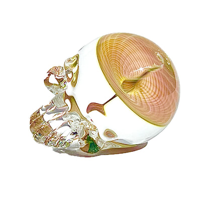 Decorative glass skull with fume vortex on a white background