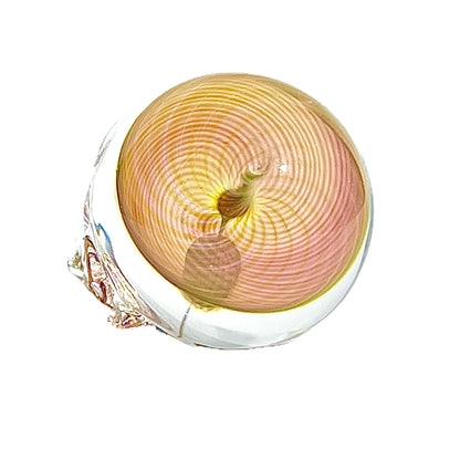 Glass skull with spiral design on a white background