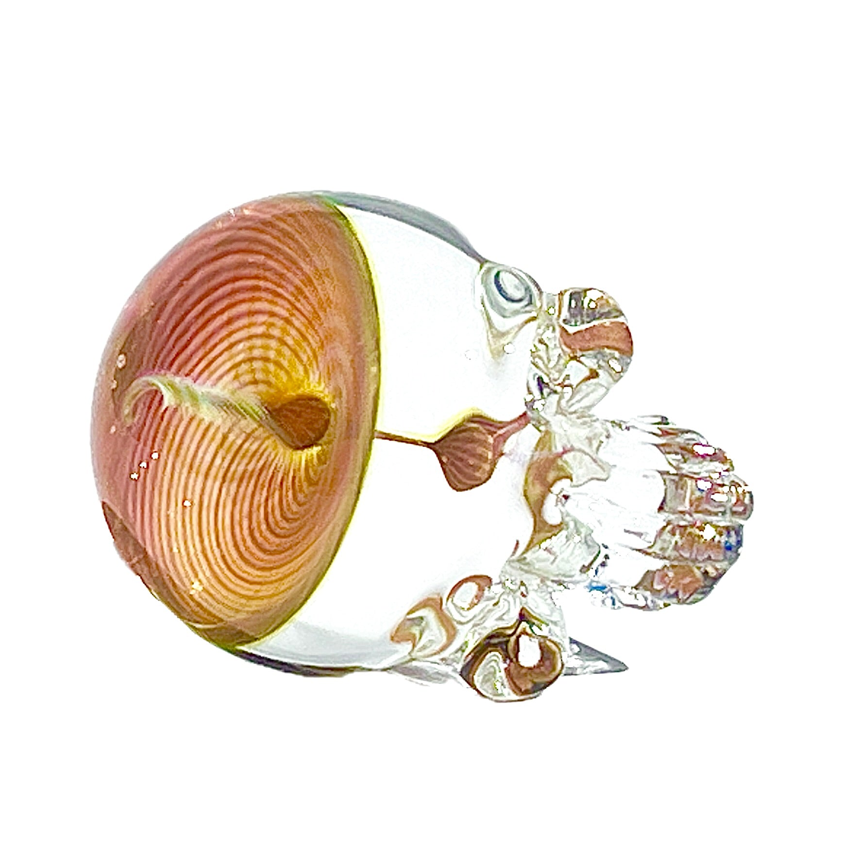 Decorative glass skull with a pink and gold spiral-like design on a white background