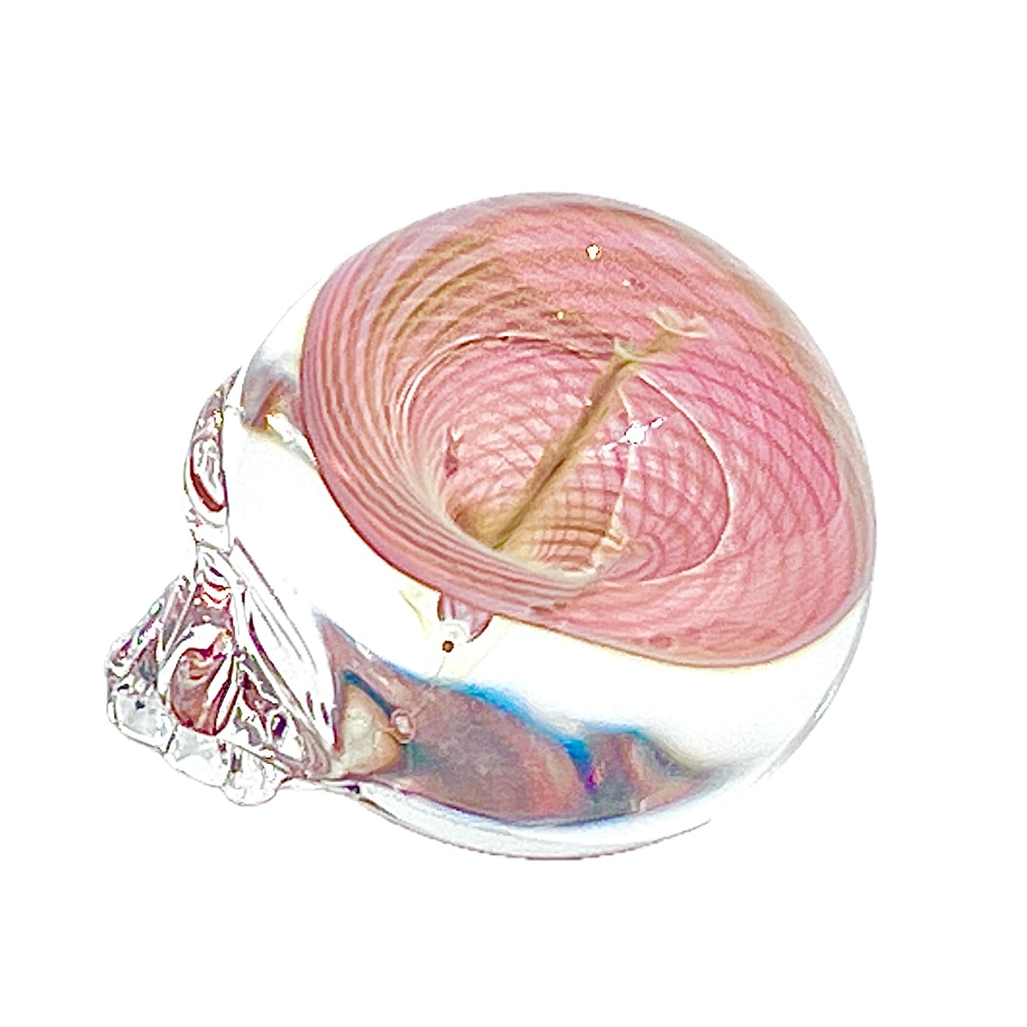 Pink vortex inside a clear glass skull on a white background