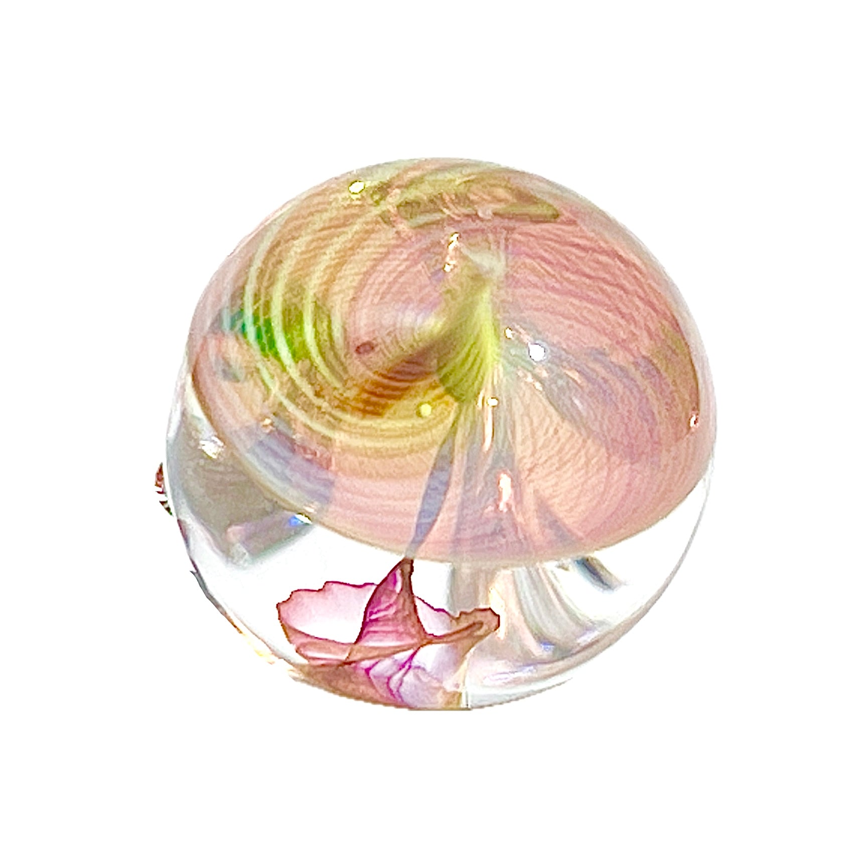 Colorful glass paperweight with a spiral design on a white background