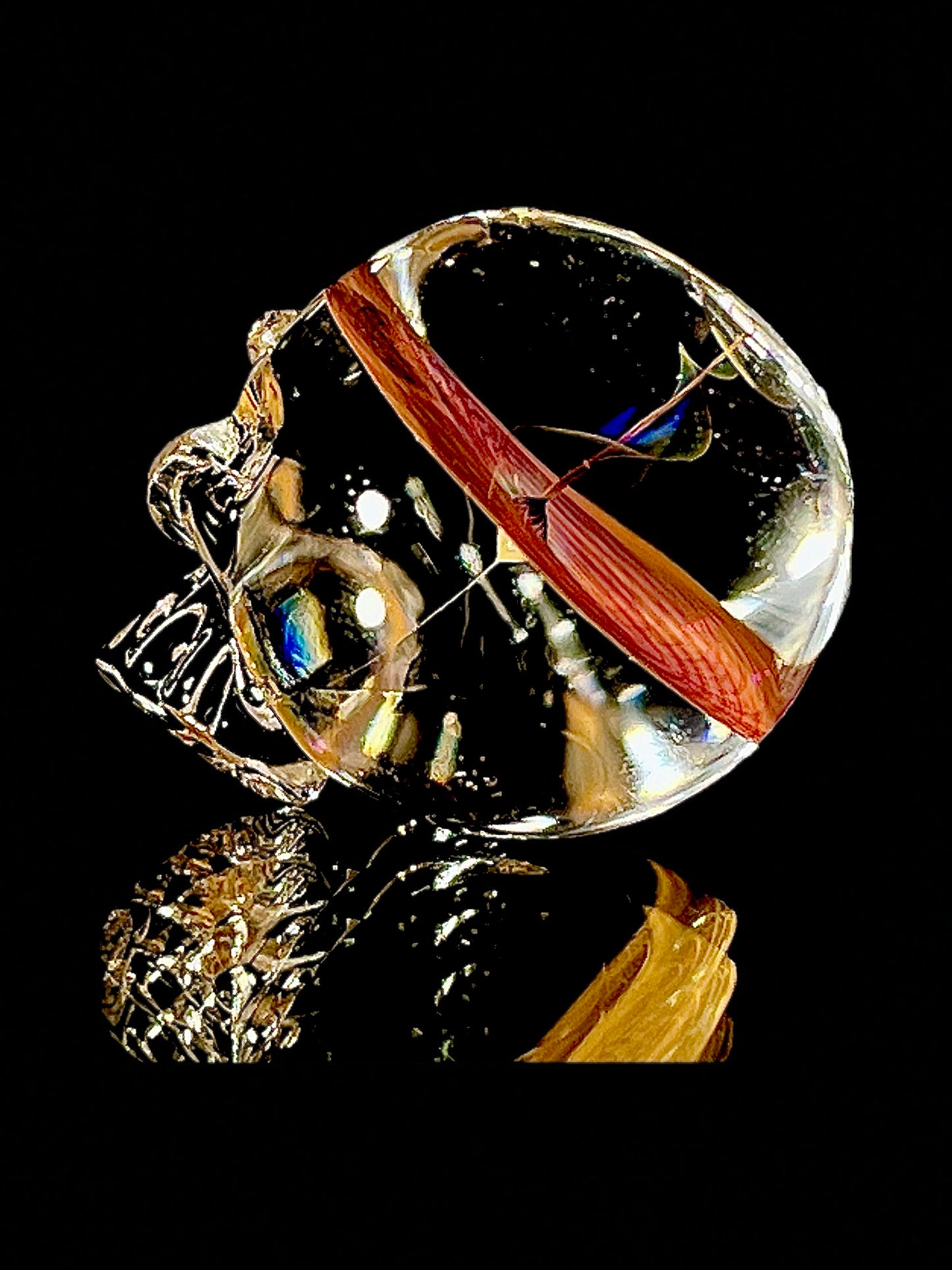 Glass skull with a vortex brain on a black background.