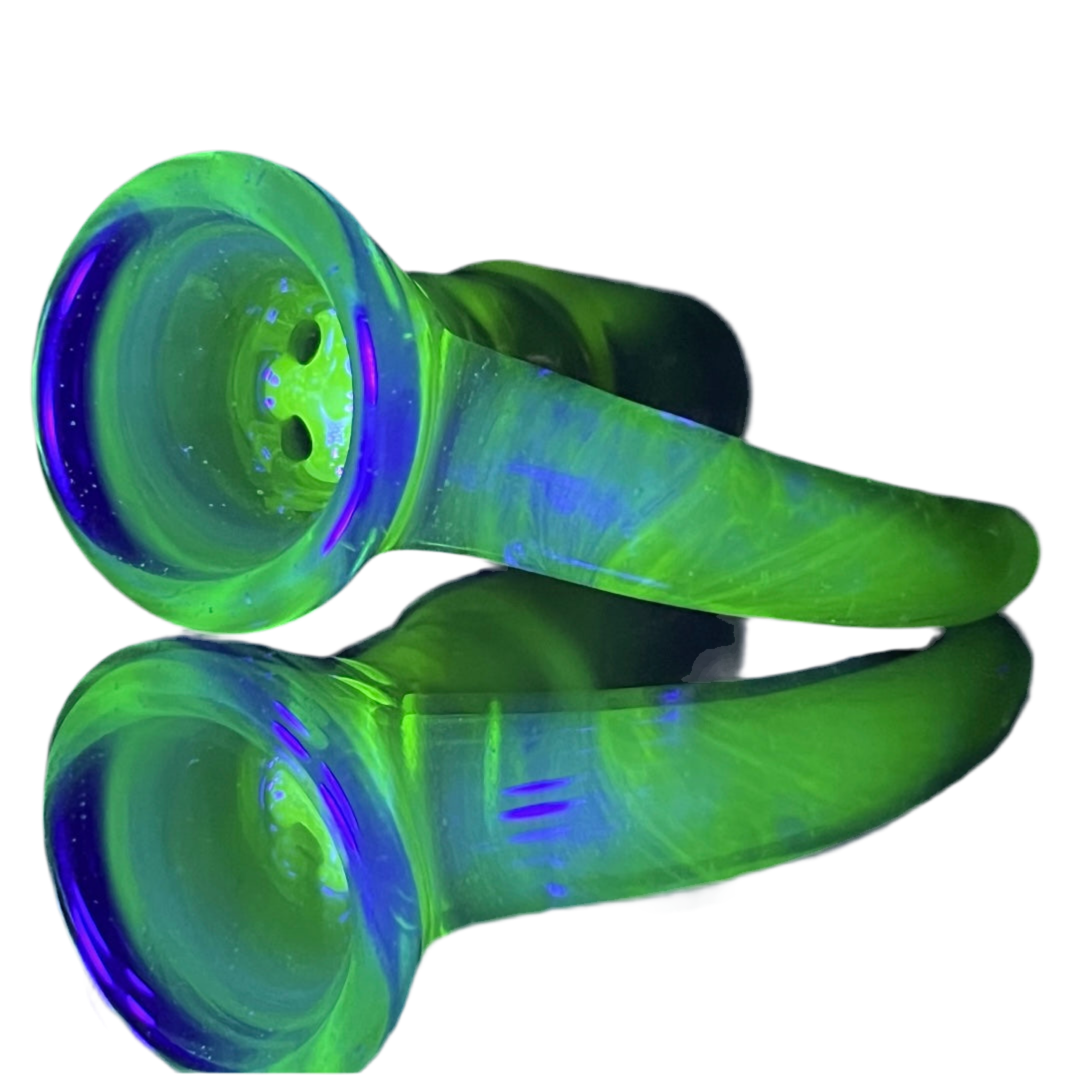 A hand-blown glass slide with a 4-hole large-pack bowl, featuring a UV reactive green and blue color.