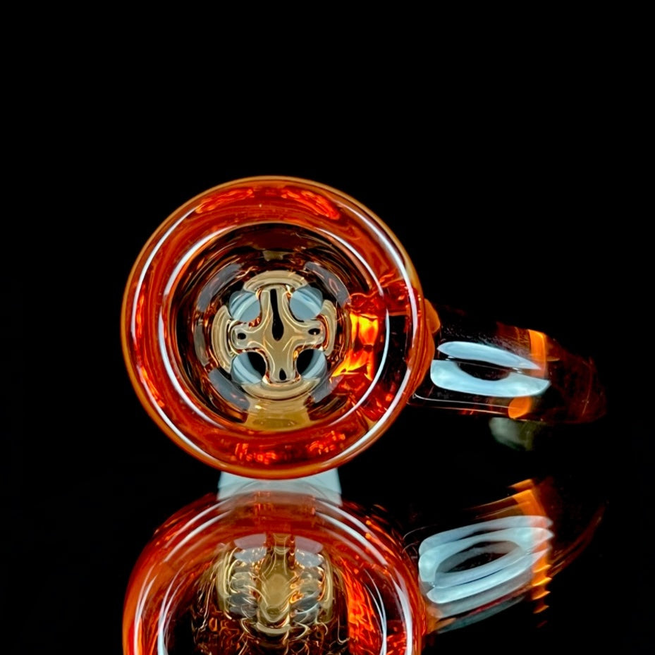 A glass slide with a curved orange bowl attached to a white stem.