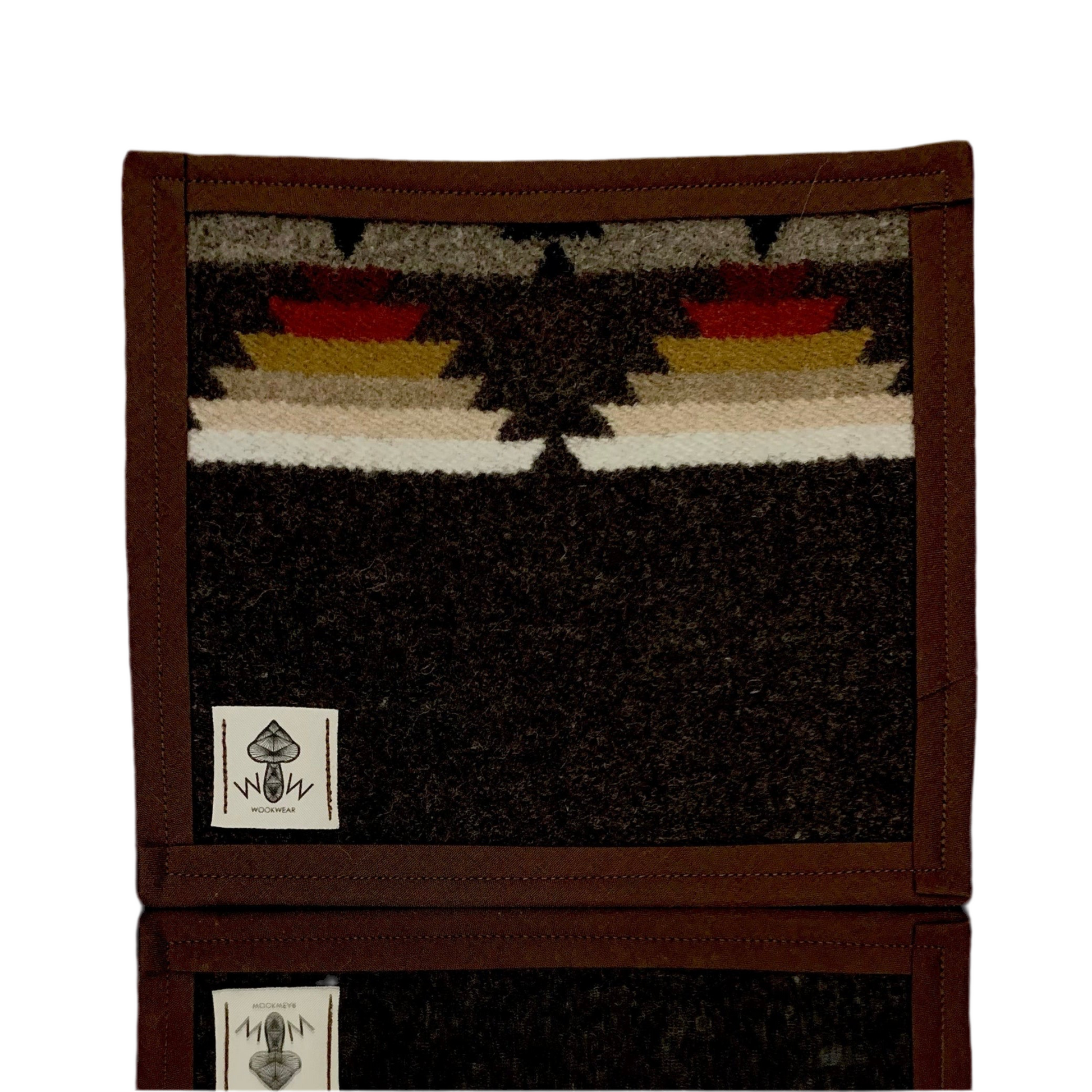 A rectangular Pendleton mat with geometric patterns primarily in black, brown, beige, and red colors, featuring the Wook Wear logo.