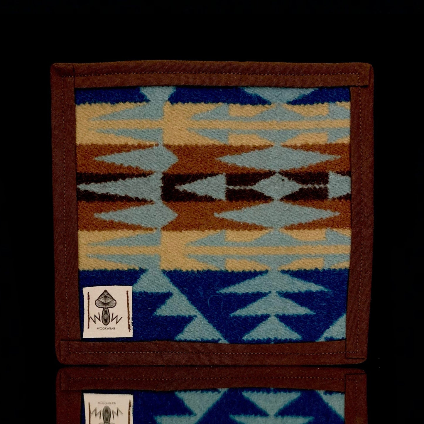 A 6" x 6" rectangular Pendleton mat with a geometric pattern in blue, brown, and beige, featuring the Pendleton logo.