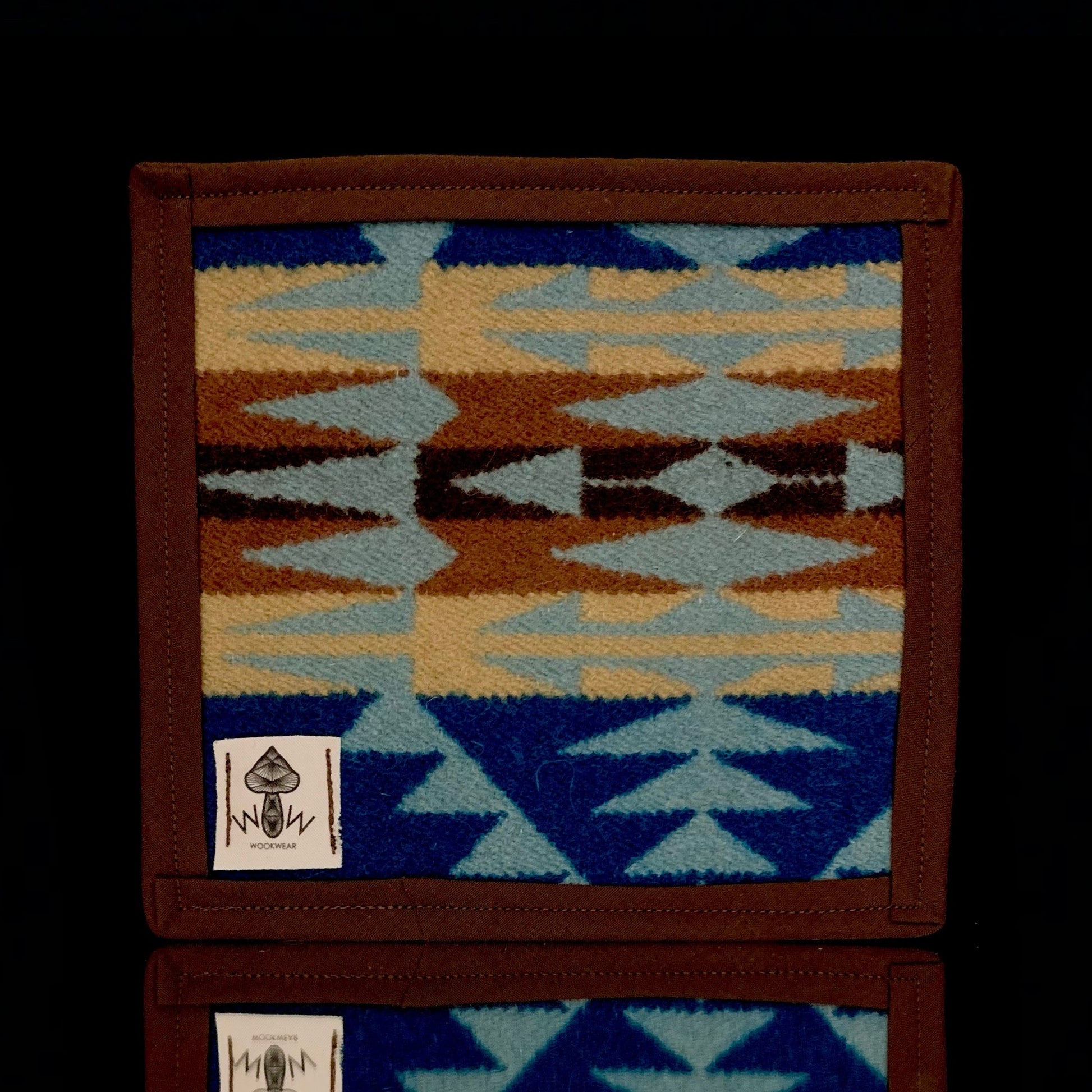 A 6" x 6" rectangular Pendleton mat with a geometric pattern in blue, brown, and beige, featuring the Pendleton logo.