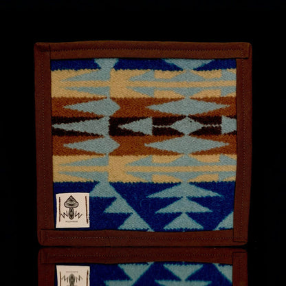 A 6" x 6" rectangular Pendleton mat with a geometric pattern in blue, brown, and beige, featuring the Pendleton logo.