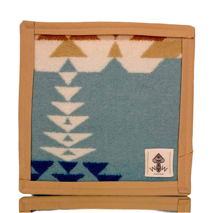A rectangular Pendleton mat with a geometric pattern in blue and beige, featuring the Wook Wear logo.