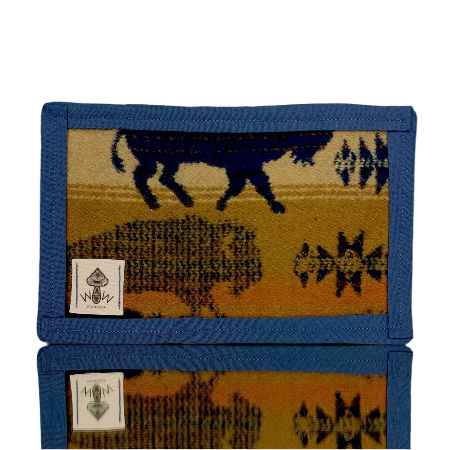 A rectangular Pendleton mat featuring an animal pattern with a buffalo in blue and beige colors.