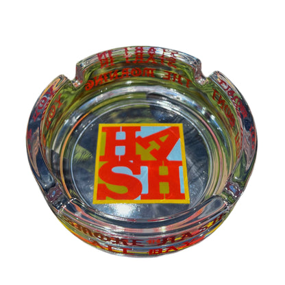 This image features the "Love Hash" Ash Tray from Wookerson Studios, released on March 11, 2023. The ash tray is round and has a transparent base with decorative elements.