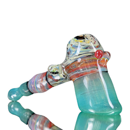 Colorful glass pipe with a reflective surface on a white background