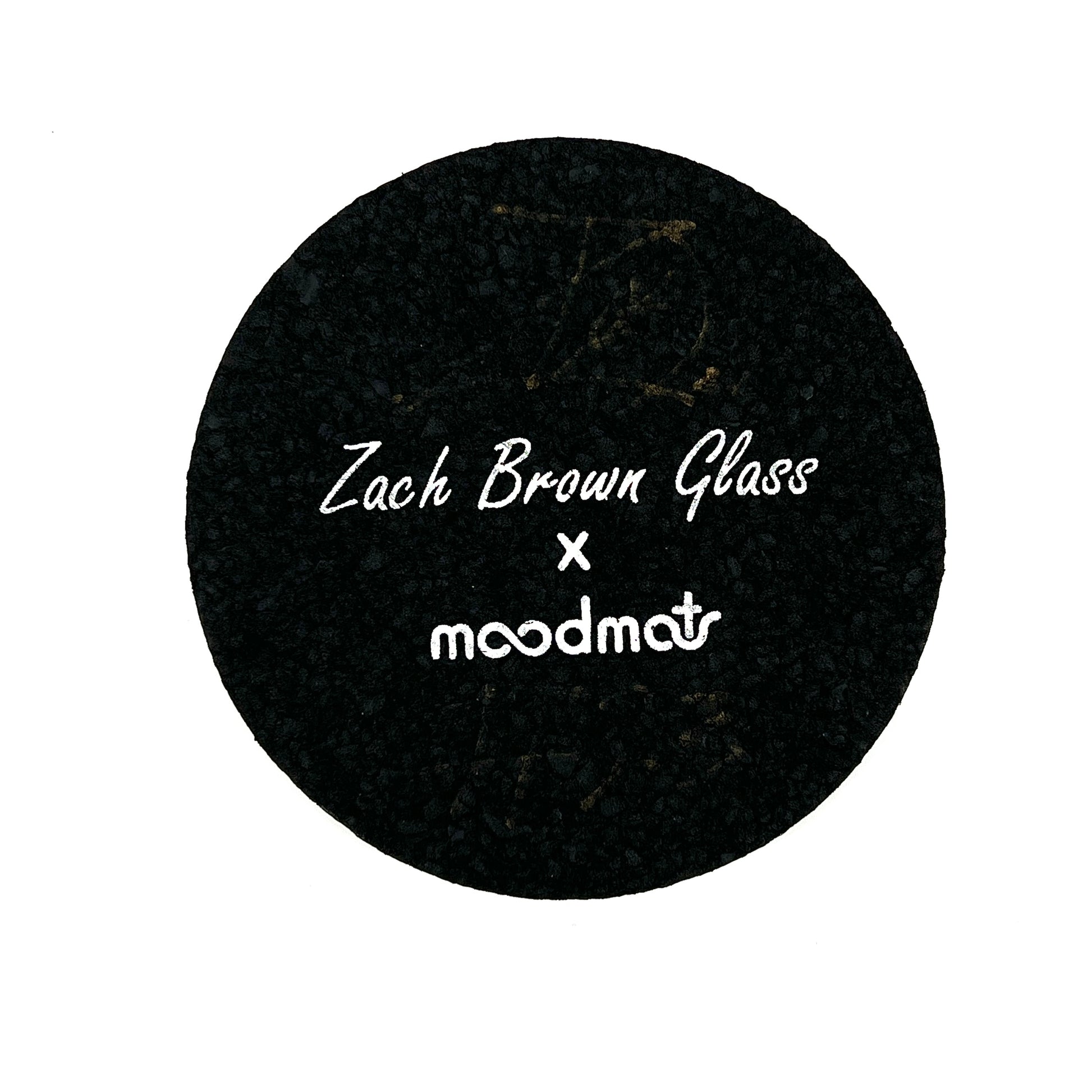 Black circular mat with 'Zach Brown Glass x moodmat' text on a white background.