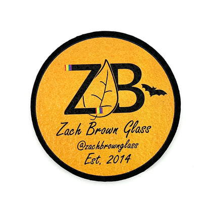 Round mat with 'ZB' logo and text on an orange background.