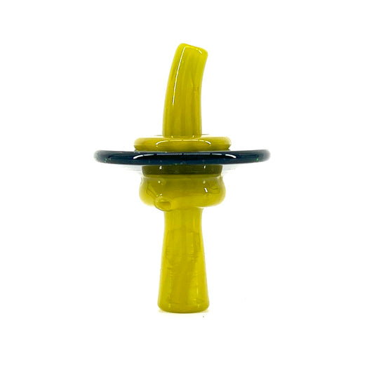 Yellow glass cap with a dark base on a white background.