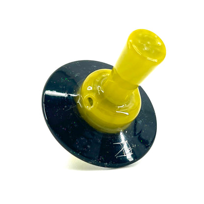 Yellow cap with a black circular base with a white background.