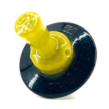 Yellow glass cap with a black circular base on a white background.