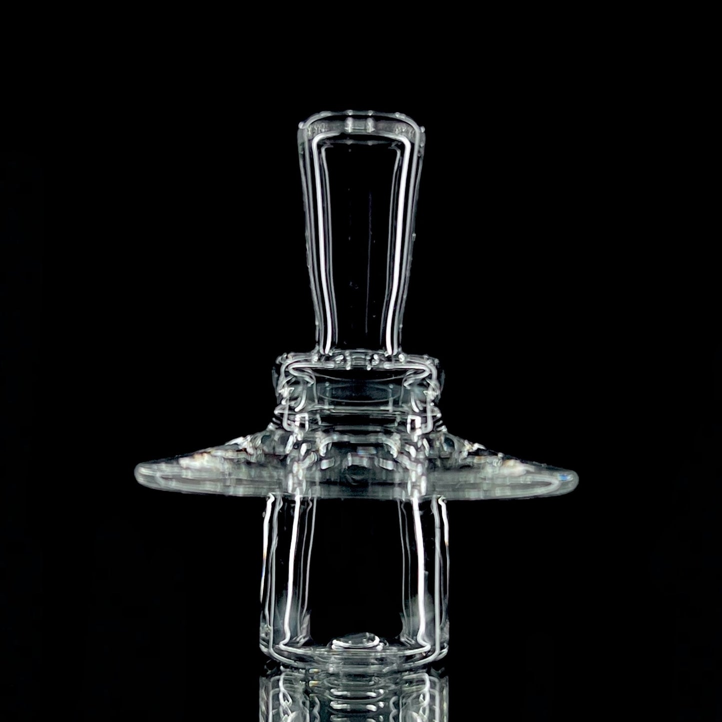 A clear glass 20mm V2 stopper for quartz slurpers, showing the side view with the fitted section.