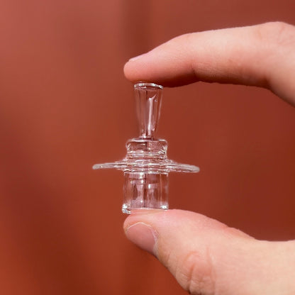 A clear glass 20mm V2 stopper for quartz slurpers, showing the side view with the fitted section.